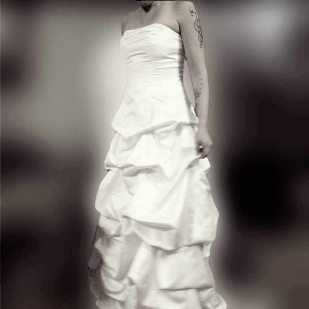 SIZE 12 David’s Bridal  White wedding gown .
